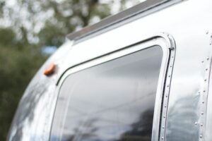 A Close-Up of the Almost Reflective Surface of an Airstream Trailer 